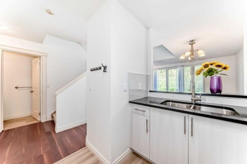 10-305 Village Mews Sw, Calgary, AB - Indoor Photo Showing Kitchen With Double Sink