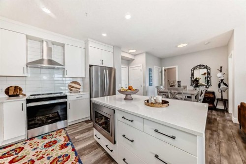 210-8355 19 Avenue Sw, Calgary, AB - Indoor Photo Showing Kitchen With Upgraded Kitchen