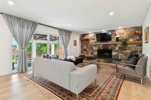 12215 Lake Erie Way Se, Calgary, AB - Indoor Photo Showing Living Room With Fireplace