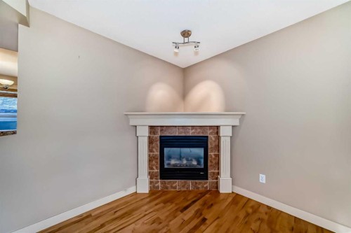 42 Ypres Green Sw, Calgary, AB - Indoor With Fireplace