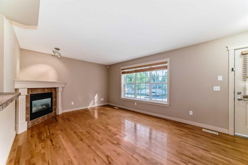 42 Ypres Green Sw, Calgary, AB - Indoor With Fireplace