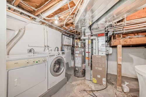 42 Ypres Green Sw, Calgary, AB - Indoor Photo Showing Laundry Room