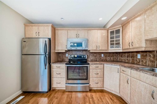 42 Ypres Green Sw, Calgary, AB - Indoor Photo Showing Kitchen With Stainless Steel Kitchen