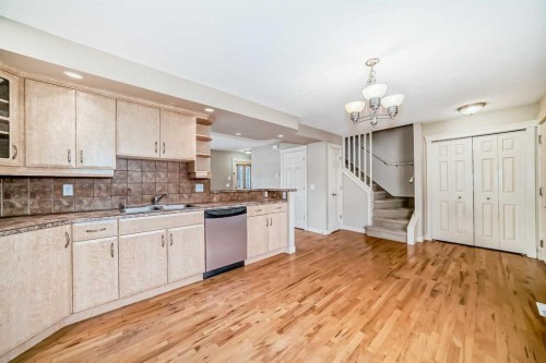 42 Ypres Green Sw, Calgary, AB - Indoor Photo Showing Kitchen With Double Sink