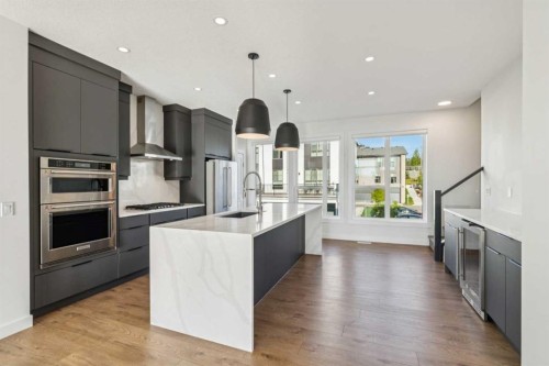 228 Sovereign Common Sw, Calgary, AB - Indoor Photo Showing Kitchen With Stainless Steel Kitchen With Upgraded Kitchen