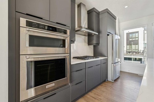 228 Sovereign Common Sw, Calgary, AB - Indoor Photo Showing Kitchen With Stainless Steel Kitchen