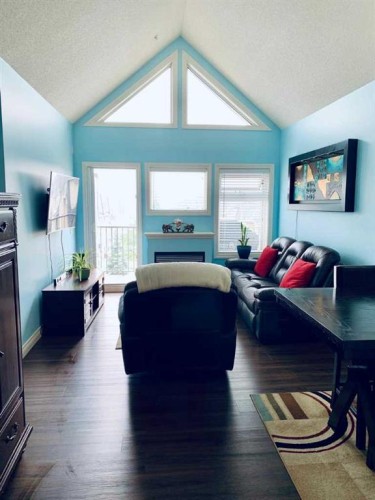 308-11170 30 Street Sw, Calgary, AB - Indoor Photo Showing Living Room With Fireplace
