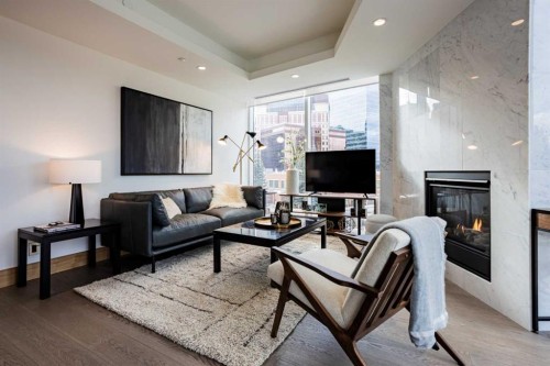301-738 1 Avenue Sw, Calgary, AB - Indoor Photo Showing Living Room With Fireplace