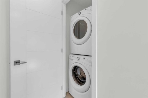 1402-350 Livingston Common Ne, Calgary, AB - Indoor Photo Showing Laundry Room