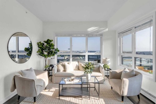 1402-350 Livingston Common Ne, Calgary, AB - Indoor Photo Showing Living Room With Fireplace