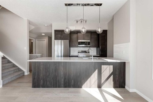 1411-250 Fireside View, Cochrane, AB - Indoor Photo Showing Kitchen With Upgraded Kitchen