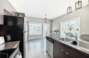 453-130 New Brighton Way Se, Calgary, AB  - Indoor Photo Showing Kitchen With Double Sink 