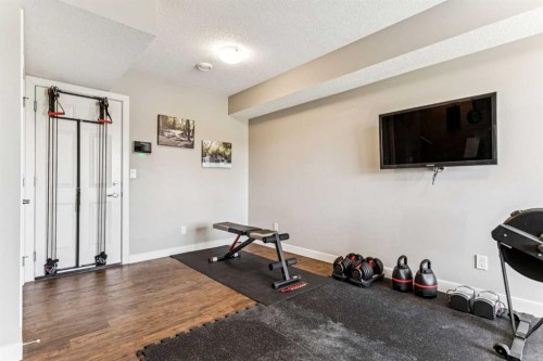 79 Redstone Circle Ne, Calgary, AB - Indoor Photo Showing Gym Room