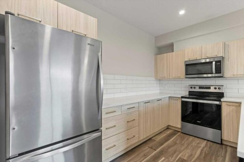 92 Saddlestone Drive Ne, Calgary, AB - Indoor Photo Showing Kitchen With Stainless Steel Kitchen