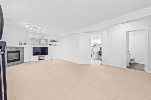 295 Coventry Road Ne, Calgary, AB - Indoor With Fireplace