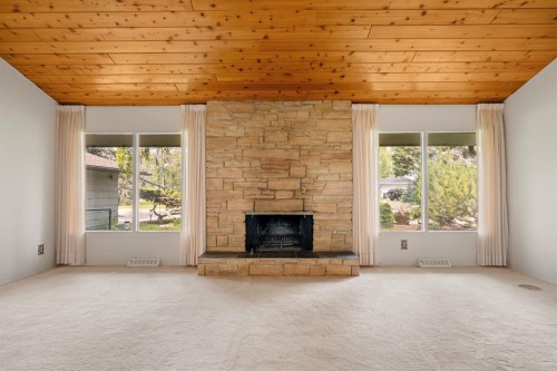 427 Willow Grove Crescent Se, Calgary, AB - Indoor Photo Showing Living Room With Fireplace