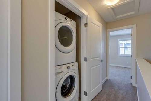 605-1225 Kings Heights Way Se, Airdrie, AB - Indoor Photo Showing Laundry Room