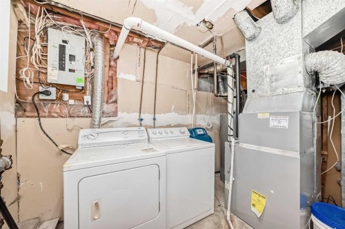 42 Taraglen Road Ne, Calgary, AB - Indoor Photo Showing Laundry Room