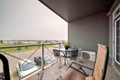 211-1005A Westmount Drive, Strathmore, AB - Outdoor With Balcony With Exterior