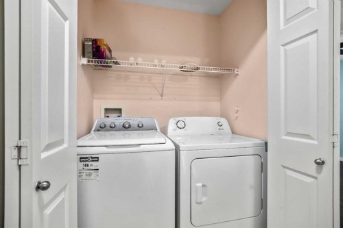 5 Country Village Landing Ne, Calgary, AB - Indoor Photo Showing Laundry Room