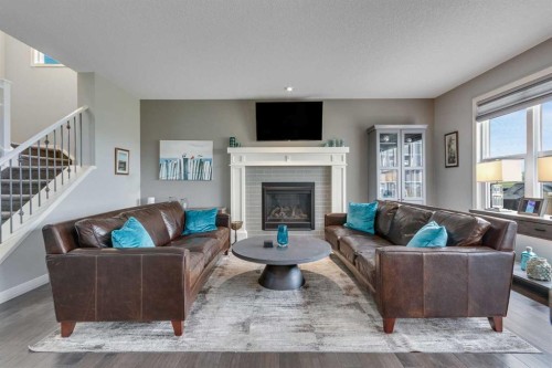 55 Sage Bluff Green Nw, Calgary, AB - Indoor Photo Showing Living Room With Fireplace