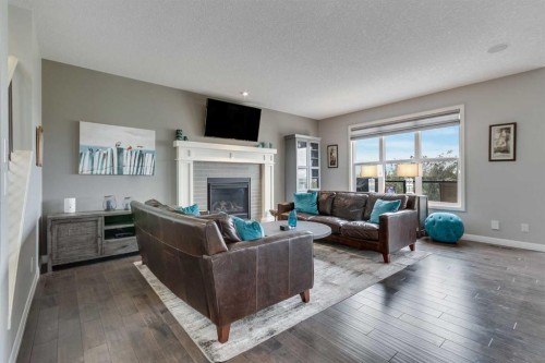 55 Sage Bluff Green Nw, Calgary, AB - Indoor Photo Showing Living Room With Fireplace