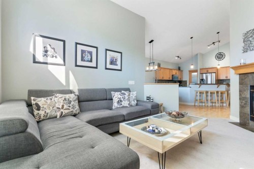 264 Windermere Drive, Chestermere, AB - Indoor Photo Showing Living Room With Fireplace