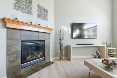 264 Windermere Drive, Chestermere, AB - Indoor Photo Showing Living Room With Fireplace
