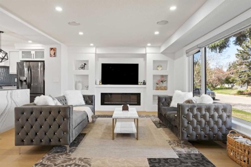 201 Wascana Crescent Se, Calgary, AB - Indoor Photo Showing Living Room With Fireplace