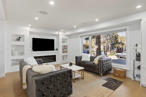 201 Wascana Crescent Se, Calgary, AB - Indoor Photo Showing Living Room With Fireplace