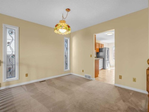 76 Wood Valley Rise Sw, Calgary, AB - Indoor Photo Showing Other Room With Fireplace