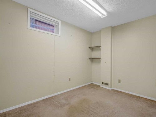 76 Wood Valley Rise Sw, Calgary, AB - Indoor Photo Showing Other Room