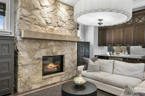 420 49 Avenue Sw, Calgary, AB - Indoor Photo Showing Living Room With Fireplace