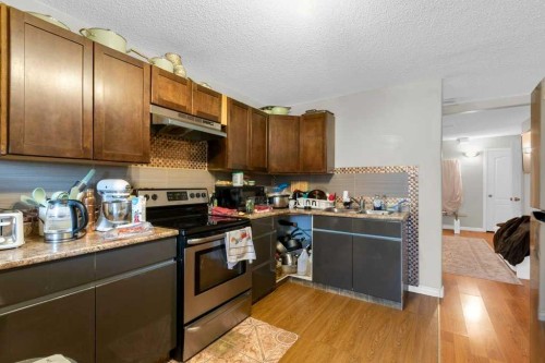 442 Saddlecreek Way Ne, Calgary, AB - Indoor Photo Showing Kitchen With Double Sink