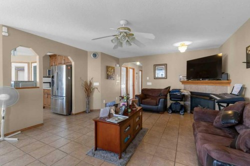 442 Saddlecreek Way Ne, Calgary, AB - Indoor Photo Showing Living Room With Fireplace