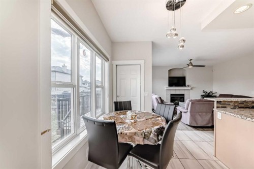 70 Martha'S Meadow Close Ne, Calgary, AB - Indoor Photo Showing Dining Room With Fireplace