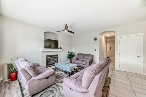 70 Martha'S Meadow Close Ne, Calgary, AB - Indoor Photo Showing Living Room With Fireplace