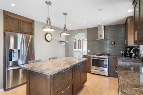 341 Sunset Place, Okotoks, AB - Indoor Photo Showing Kitchen With Upgraded Kitchen