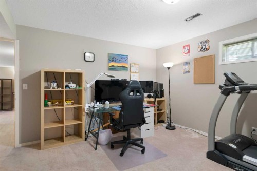 341 Sunset Place, Okotoks, AB - Indoor Photo Showing Gym Room
