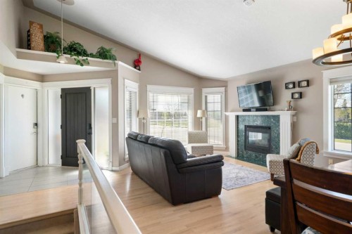341 Sunset Place, Okotoks, AB - Indoor Photo Showing Living Room With Fireplace