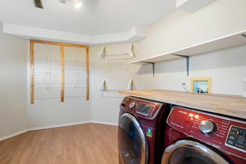 341 Sunset Place, Okotoks, AB - Indoor Photo Showing Laundry Room