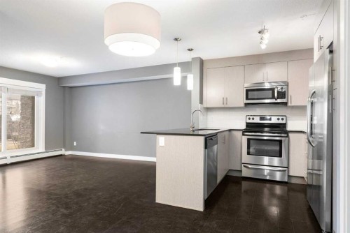 2110-240 Skyview Ranch Road Ne, Calgary, AB - Indoor Photo Showing Kitchen With Stainless Steel Kitchen With Upgraded Kitchen