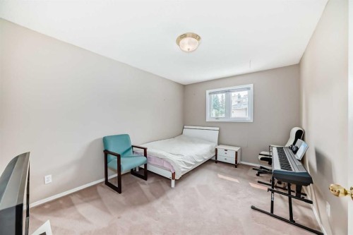 1405 Shawnee Road Sw, Calgary, AB - Indoor Photo Showing Bedroom
