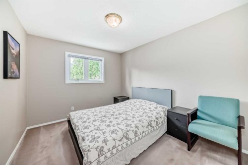 1405 Shawnee Road Sw, Calgary, AB - Indoor Photo Showing Bedroom