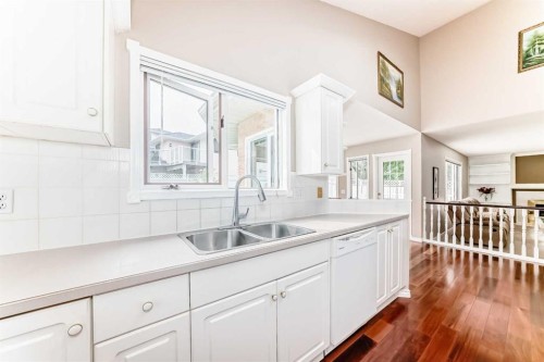 1405 Shawnee Road Sw, Calgary, AB - Indoor Photo Showing Kitchen With Double Sink