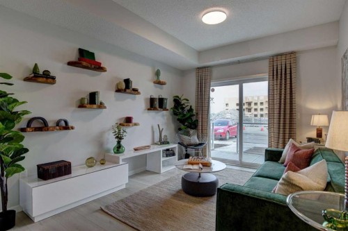 409-245 Edith Place Nw, Calgary, AB - Indoor Photo Showing Living Room