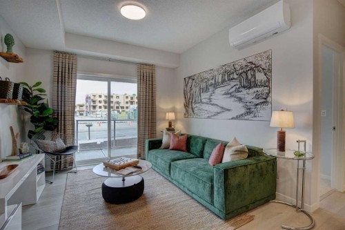 409-245 Edith Place Nw, Calgary, AB - Indoor Photo Showing Living Room
