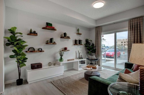 409-245 Edith Place Nw, Calgary, AB - Indoor Photo Showing Living Room
