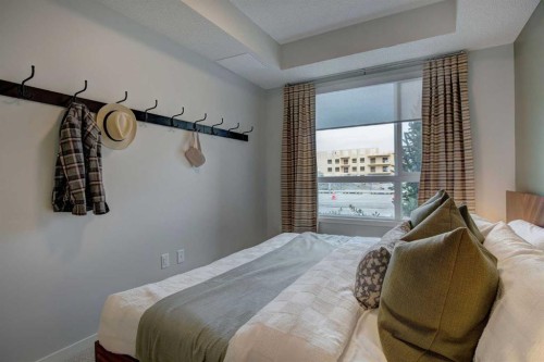 409-245 Edith Place Nw, Calgary, AB - Indoor Photo Showing Bedroom