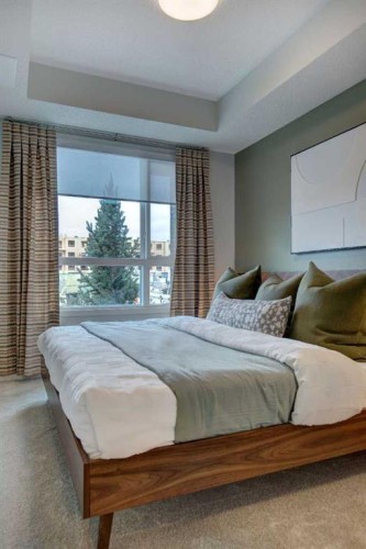 409-245 Edith Place Nw, Calgary, AB - Indoor Photo Showing Bedroom